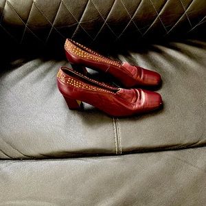 Gently used, studded, burgundy heels. Approximately 3 inches.